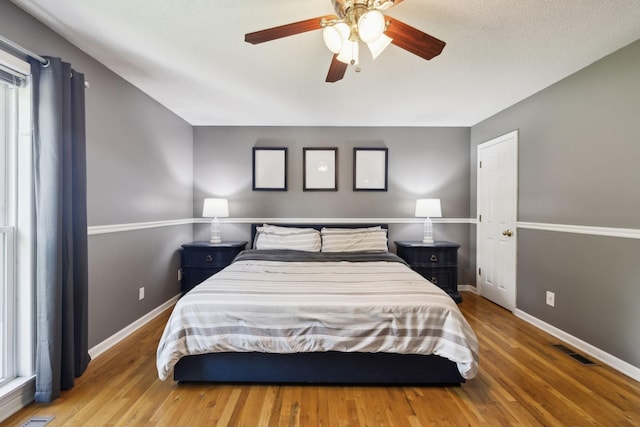 114 Clover Dr, Columbia, TN 38401 - bedroom with baseboards, wood finished floors, and ceiling fan