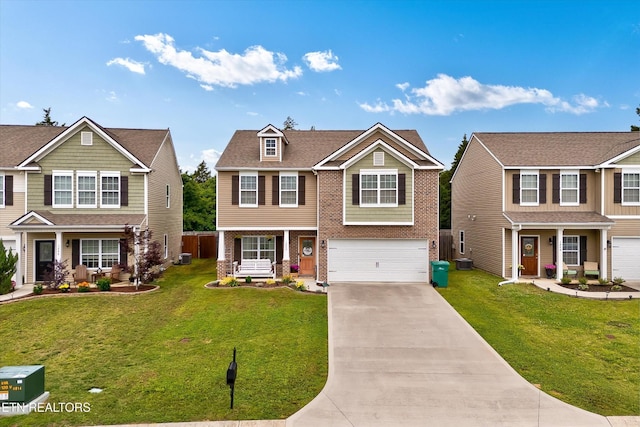 1242 Bill Wallace Dr, Friendsville, TN 37737 - view of front of home featuring covered porch, an attached garage, driveway, and brick siding