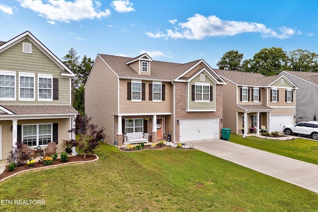 1242 Bill Wallace Dr, Friendsville, TN 37737 - view of front of home featuring a garage, concrete driveway, a front lawn, and brick siding