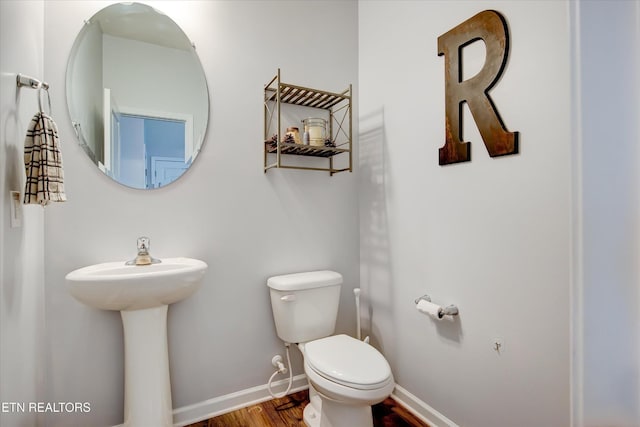 1242 Bill Wallace Dr, Friendsville, TN 37737 - bathroom with toilet, wood finished floors, and baseboards