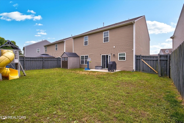 1242 Bill Wallace Dr, Friendsville, TN 37737 - back of house with a patio area and a playground