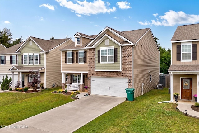 1242 Bill Wallace Dr, Friendsville, TN 37737 - view of front facade featuring an attached garage, a front yard, concrete driveway, and brick siding