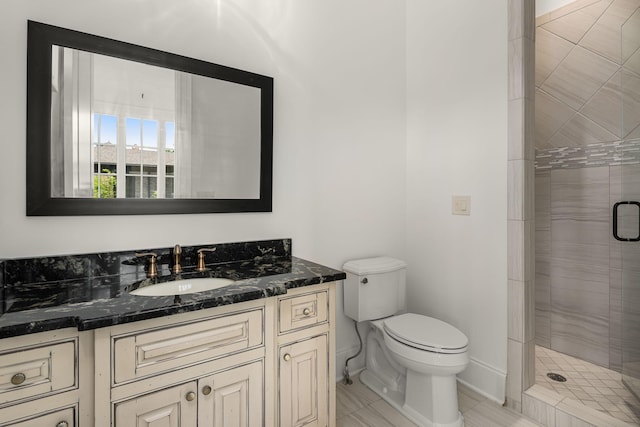443 Canterbury Rise, Franklin, TN 37067 - full bathroom featuring a shower stall, toilet, vanity, and baseboards