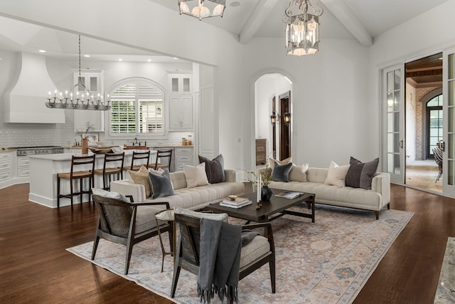 443 Canterbury Rise, Franklin, TN 37067 - living room featuring a chandelier, arched walkways, beamed ceiling, dark wood-style floors, and recessed lighting