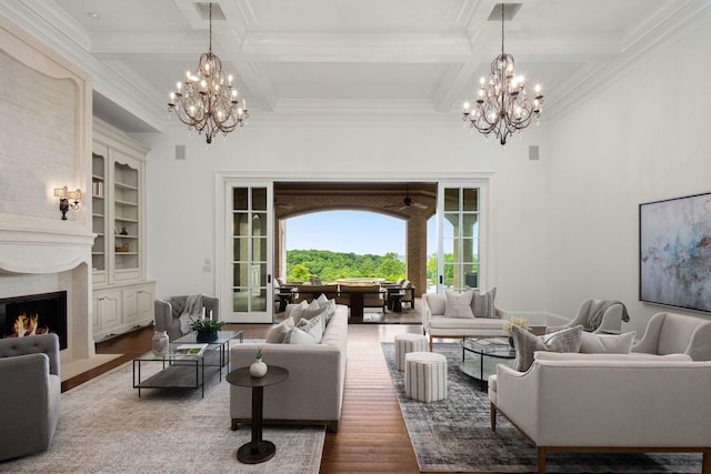 443 Canterbury Rise, Franklin, TN 37067 - living room with a chandelier, ornamental molding, coffered ceiling, wood finished floors, and a fireplace
