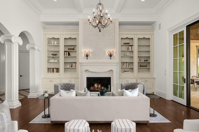 443 Canterbury Rise, Franklin, TN 37067 - living room with dark wood-style flooring, a chandelier, ornate columns, arched walkways, and crown molding