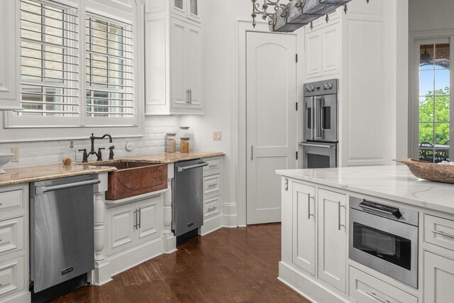 443 Canterbury Rise, Franklin, TN 37067 - kitchen featuring stainless steel appliances, white cabinetry, decorative backsplash, and dark wood-style floors