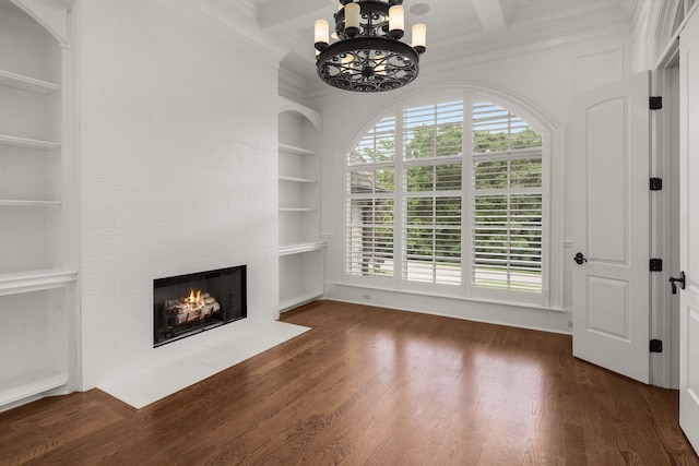 443 Canterbury Rise, Franklin, TN 37067 - unfurnished living room featuring built in features, ornamental molding, a fireplace, a chandelier, and beamed ceiling