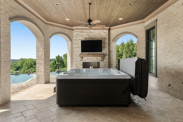 443 Canterbury Rise, Franklin, TN 37067 - view of patio / terrace with an outdoor stone fireplace, a ceiling fan, and an outdoor pool