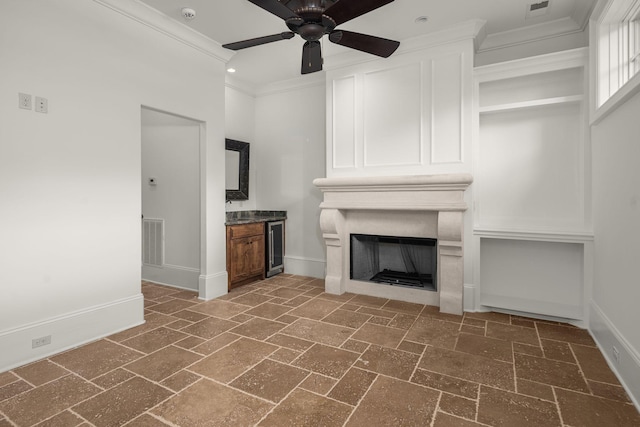 443 Canterbury Rise, Franklin, TN 37067 - unfurnished living room with crown molding, baseboards, a ceiling fan, and a large fireplace