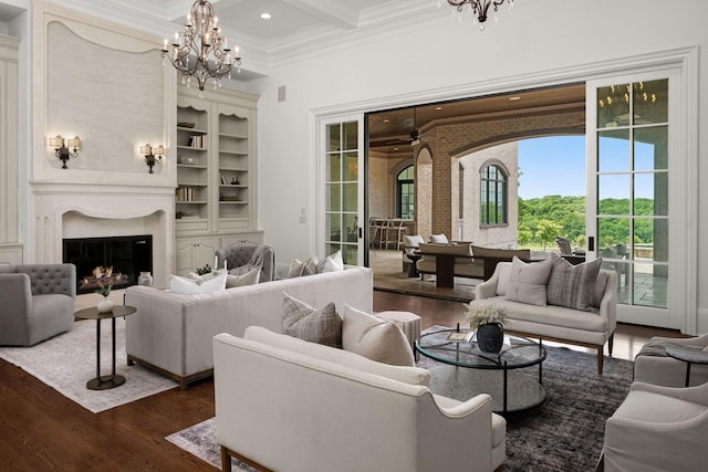 443 Canterbury Rise, Franklin, TN 37067 - living room with a chandelier, ornamental molding, dark wood finished floors, beam ceiling, and a high ceiling