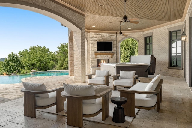 443 Canterbury Rise, Franklin, TN 37067 - view of patio with an outdoor pool, ceiling fan, a hot tub, and an outdoor stone fireplace