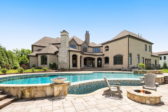 443 Canterbury Rise, Franklin, TN 37067 - view of pool featuring a fire pit, a patio area, and a pool with connected hot tub