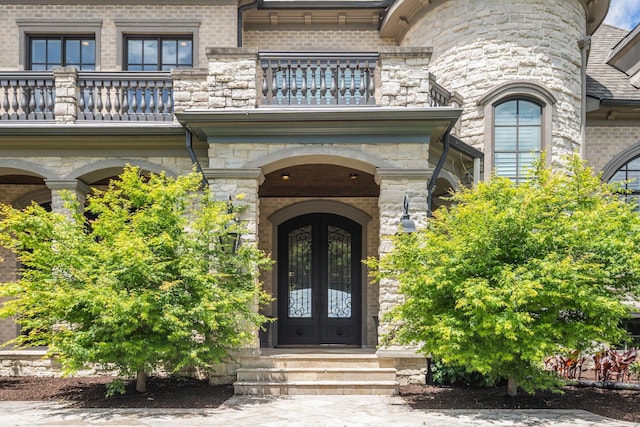 443 Canterbury Rise, Franklin, TN 37067 - doorway to property with a balcony, french doors, stone siding, and brick siding