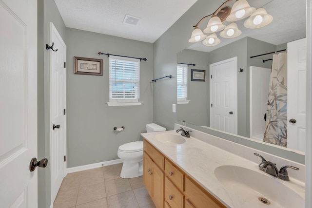 bathroom with tile patterned floors, toilet, double vanity, baseboards, and curtained shower