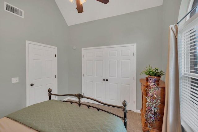 bedroom with carpet floors, a closet, high vaulted ceiling, ceiling fan, and baseboards