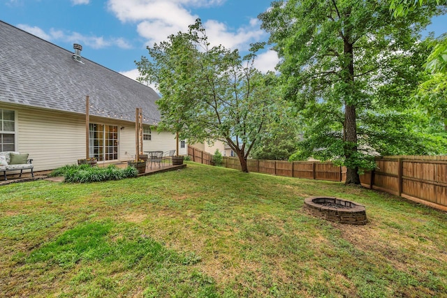 view of yard with a fire pit and a patio area