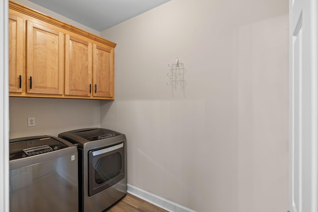 513 Leicester Ct, Franklin, TN 37067 - laundry area with cabinet space, washing machine and dryer, and wood finished floors