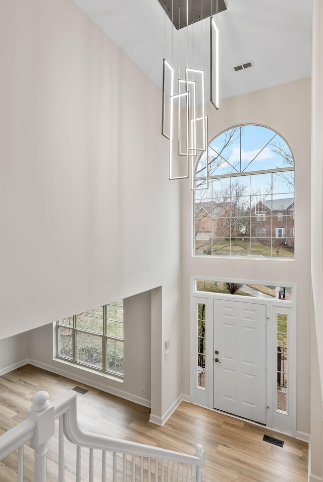513 Leicester Ct, Franklin, TN 37067 - entrance foyer with a high ceiling, wood finished floors, and healthy amount of natural light