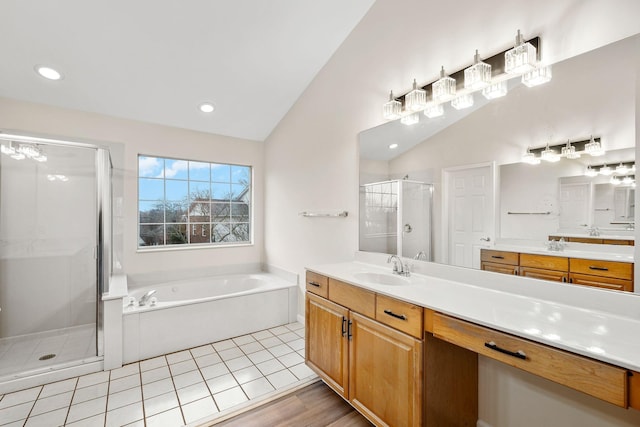 513 Leicester Ct, Franklin, TN 37067 - bathroom featuring a shower stall, a bath, lofted ceiling, vanity, and recessed lighting