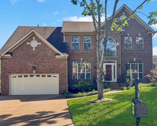 513 Leicester Ct, Franklin, TN 37067 - traditional home featuring concrete driveway, brick siding, a front lawn, and roof with shingles