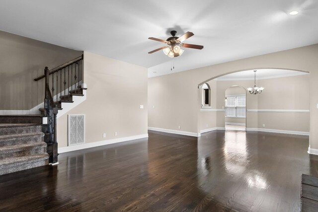 1685 Apache Way, Clarksville, TN 37042 - unfurnished living room featuring ceiling fan, arched walkways, wood finished floors, stairs, and a chandelier