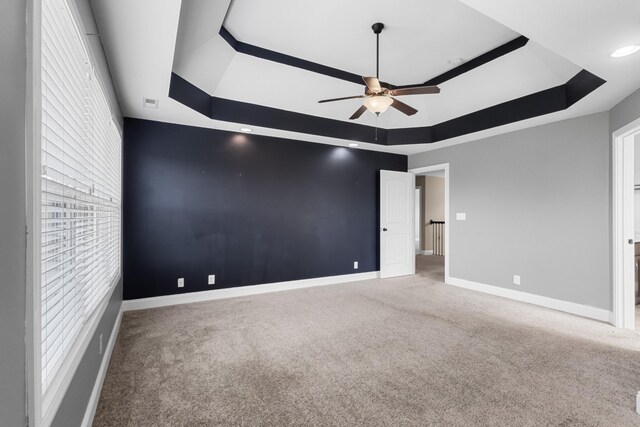 1685 Apache Way, Clarksville, TN 37042 - unfurnished bedroom featuring a raised ceiling, carpet, baseboards, and a ceiling fan