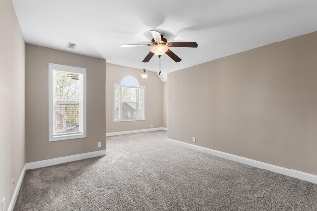 1685 Apache Way, Clarksville, TN 37042 - spare room with light colored carpet, a ceiling fan, baseboards, and lofted ceiling