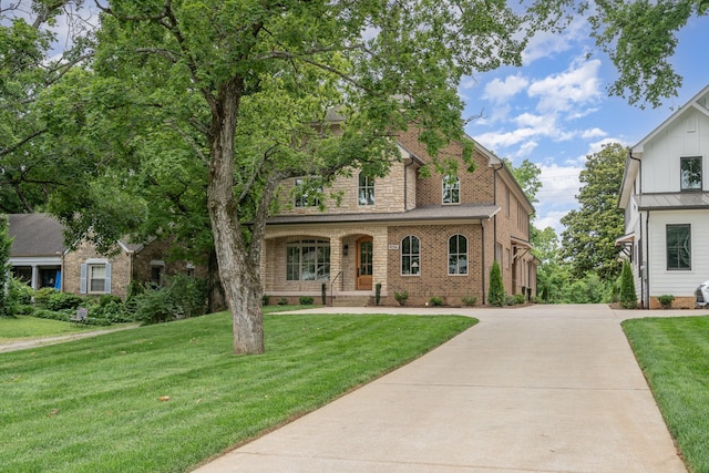 909 Gale Ln Unit A, Nashville, TN 37204 - view of front of property with a front yard, concrete driveway, and brick siding