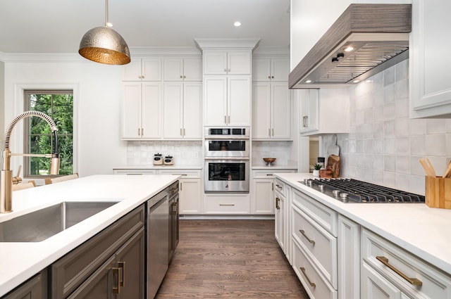 909 Gale Ln Unit A, Nashville, TN 37204 - kitchen with a sink, wall chimney exhaust hood, stainless steel appliances, tasteful backsplash, and recessed lighting