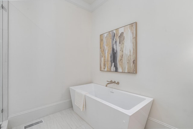 909 Gale Ln Unit A, Nashville, TN 37204 - full bath with a soaking tub, marble look tiles, ornamental molding, and baseboards