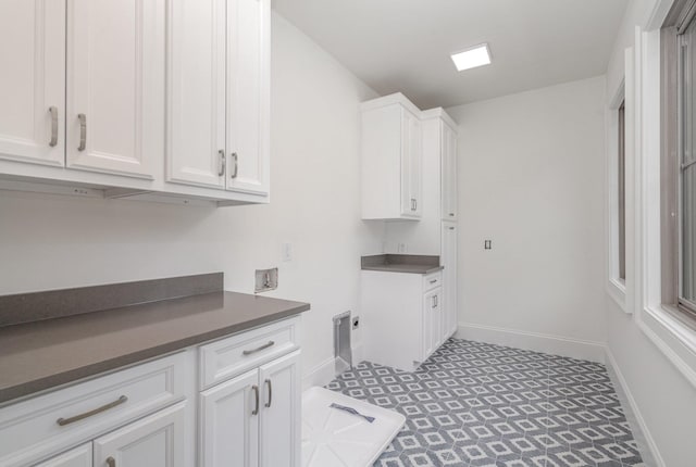 909 Gale Ln Unit A, Nashville, TN 37204 - laundry room with cabinet space, washer hookup, baseboards, and electric dryer hookup