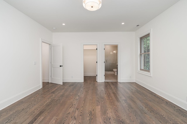909 Gale Ln Unit A, Nashville, TN 37204 - unfurnished bedroom with wood finished floors, a walk in closet, baseboards, recessed lighting, and ensuite bath