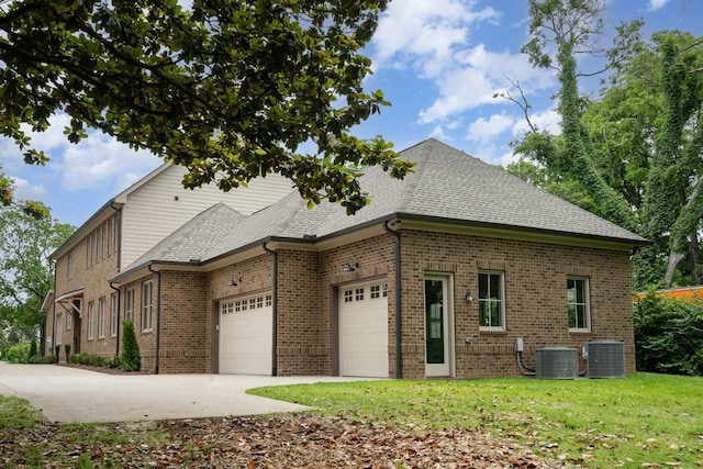 909 Gale Ln Unit A, Nashville, TN 37204 - view of front of property with an attached garage, brick siding, concrete driveway, cooling unit, and a shingled roof