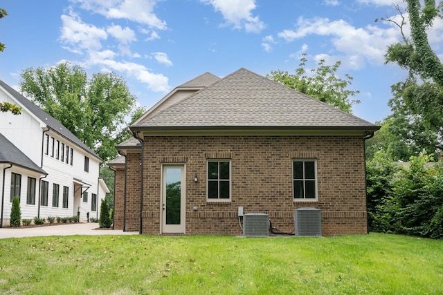 909 Gale Ln Unit A, Nashville, TN 37204 - back of property with central air condition unit, brick siding, and a lawn