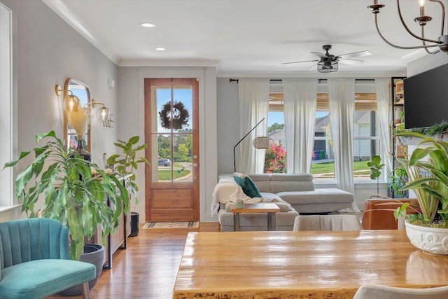 living area with wood finished floors, a ceiling fan, and recessed lighting