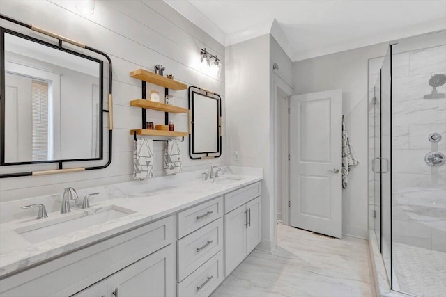 bathroom with a shower stall, marble look tile flooring, and double vanity