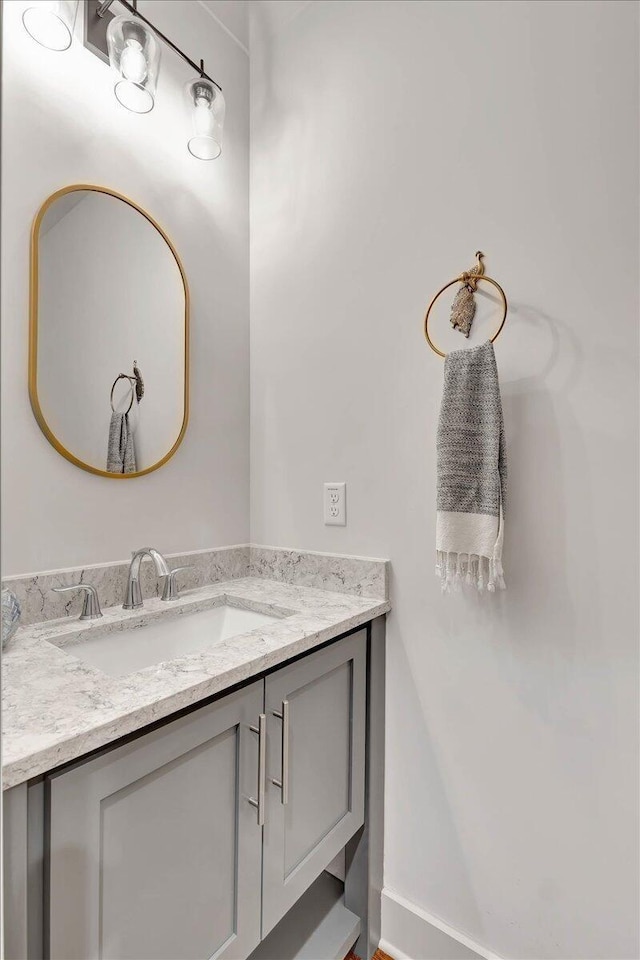 bathroom featuring vanity and baseboards