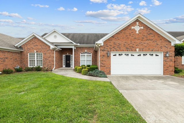 153 Magnolia Glen Cir, Manchester, TN 37355 - view of front facade with a front yard, a garage, brick siding, driveway, and roof with shingles