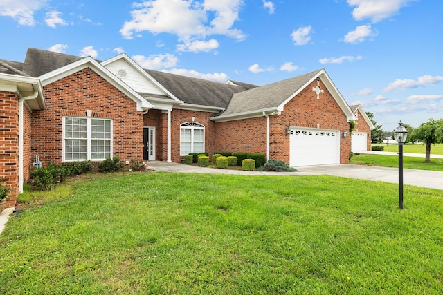 153 Magnolia Glen Cir, Manchester, TN 37355 - view of front facade with brick siding, a front lawn, and a garage