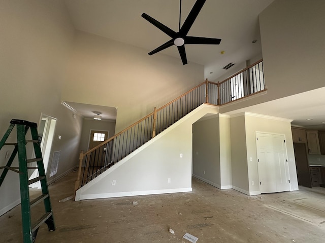 1067 Robert Lee Dr, Gallatin, TN 37066 - unfurnished living room with a towering ceiling, baseboards, stairway, and ceiling fan