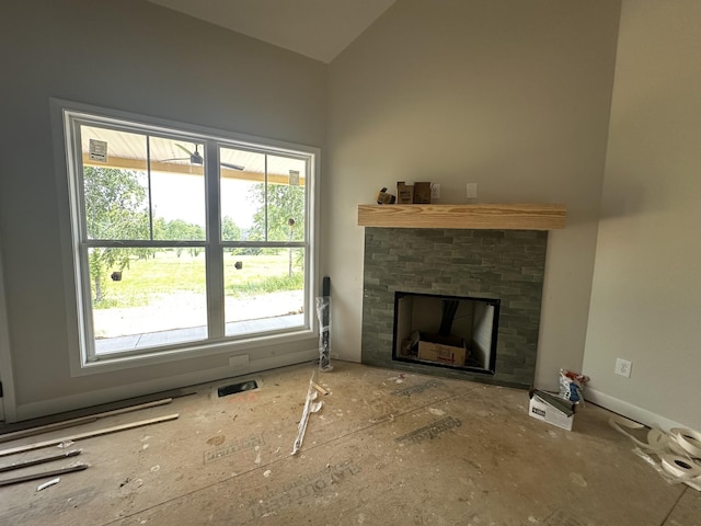 1067 Robert Lee Dr, Gallatin, TN 37066 - unfurnished living room featuring a fireplace and vaulted ceiling