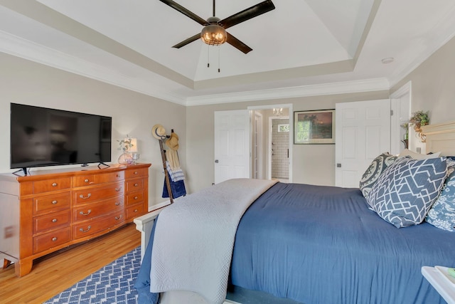213 Hickory Trl, White House, TN 37188 - bedroom featuring wood finished floors, a tray ceiling, crown molding, and a ceiling fan