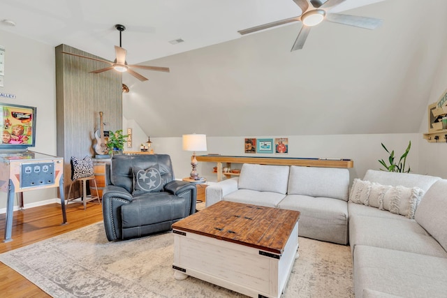 213 Hickory Trl, White House, TN 37188 - living room featuring a ceiling fan, vaulted ceiling, and light wood-style flooring