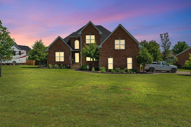 213 Hickory Trl, White House, TN 37188 - traditional-style home with brick siding and a front lawn