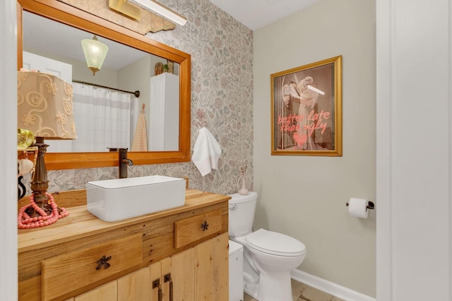 213 Hickory Trl, White House, TN 37188 - full bath featuring toilet, wallpapered walls, baseboards, and vanity