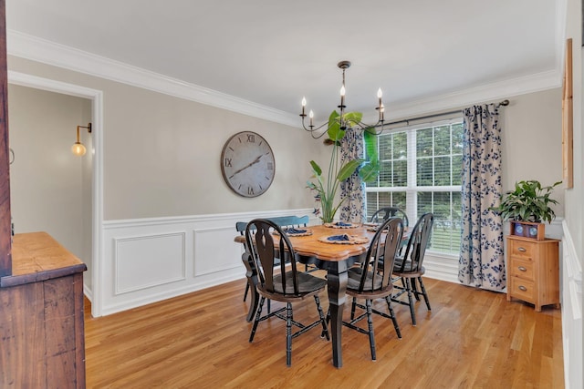 213 Hickory Trl, White House, TN 37188 - dining room with a chandelier, crown molding, light wood finished floors, and a wainscoted wall