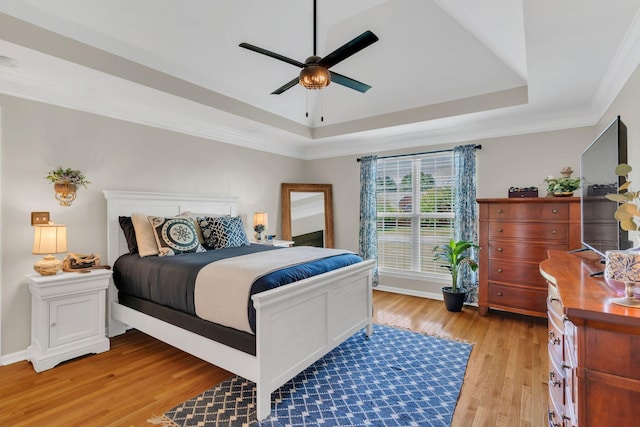 213 Hickory Trl, White House, TN 37188 - bedroom with a raised ceiling, light wood-style flooring, baseboards, crown molding, and a ceiling fan
