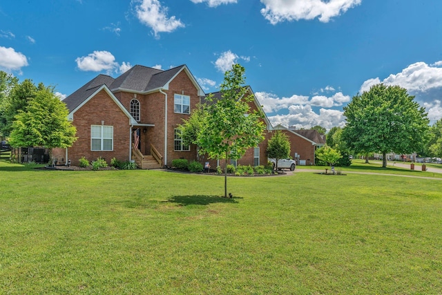 213 Hickory Trl, White House, TN 37188 - traditional-style home featuring brick siding and a front lawn