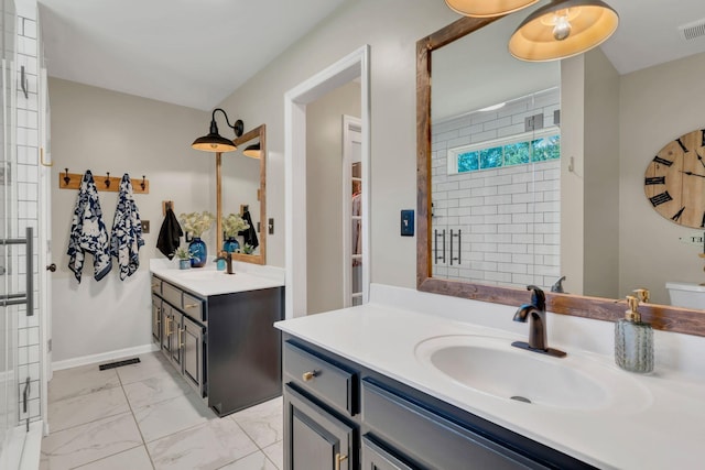 213 Hickory Trl, White House, TN 37188 - full bathroom featuring marble look tile flooring, a shower stall, and two vanities